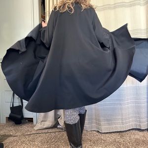 Classic long coat in black.  Dresses up anything you wear!